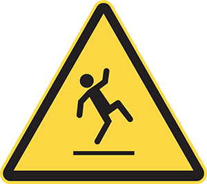yellow triangle hazard sign showing a trip or slip hazard